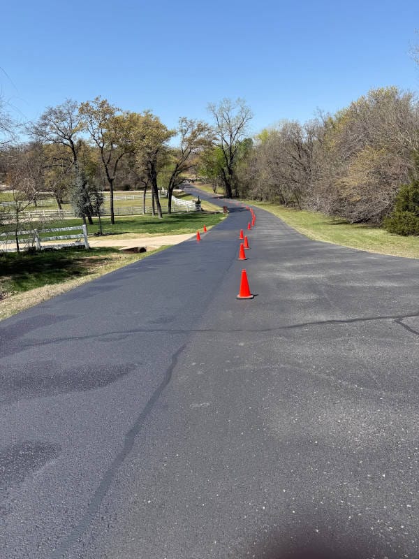 sealcoating drying on roadway