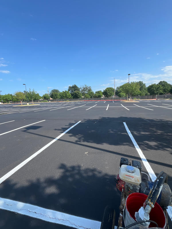 Parking lot stripes being painted
