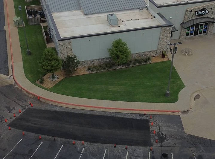 areal view of a asphalt repair in the parking lot of Life.Chruch in eDmond